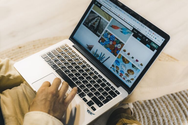 Person browsing on a silver laptop