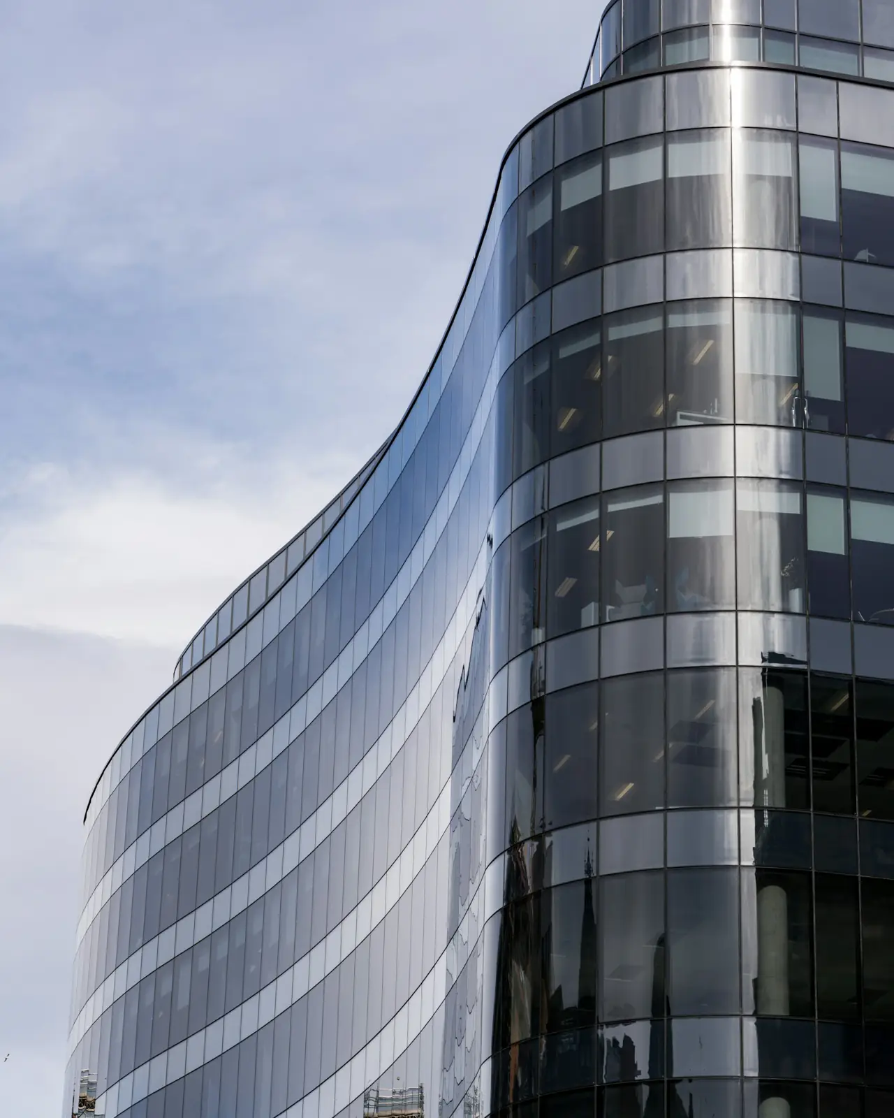 Curved glass facade of a modern office building