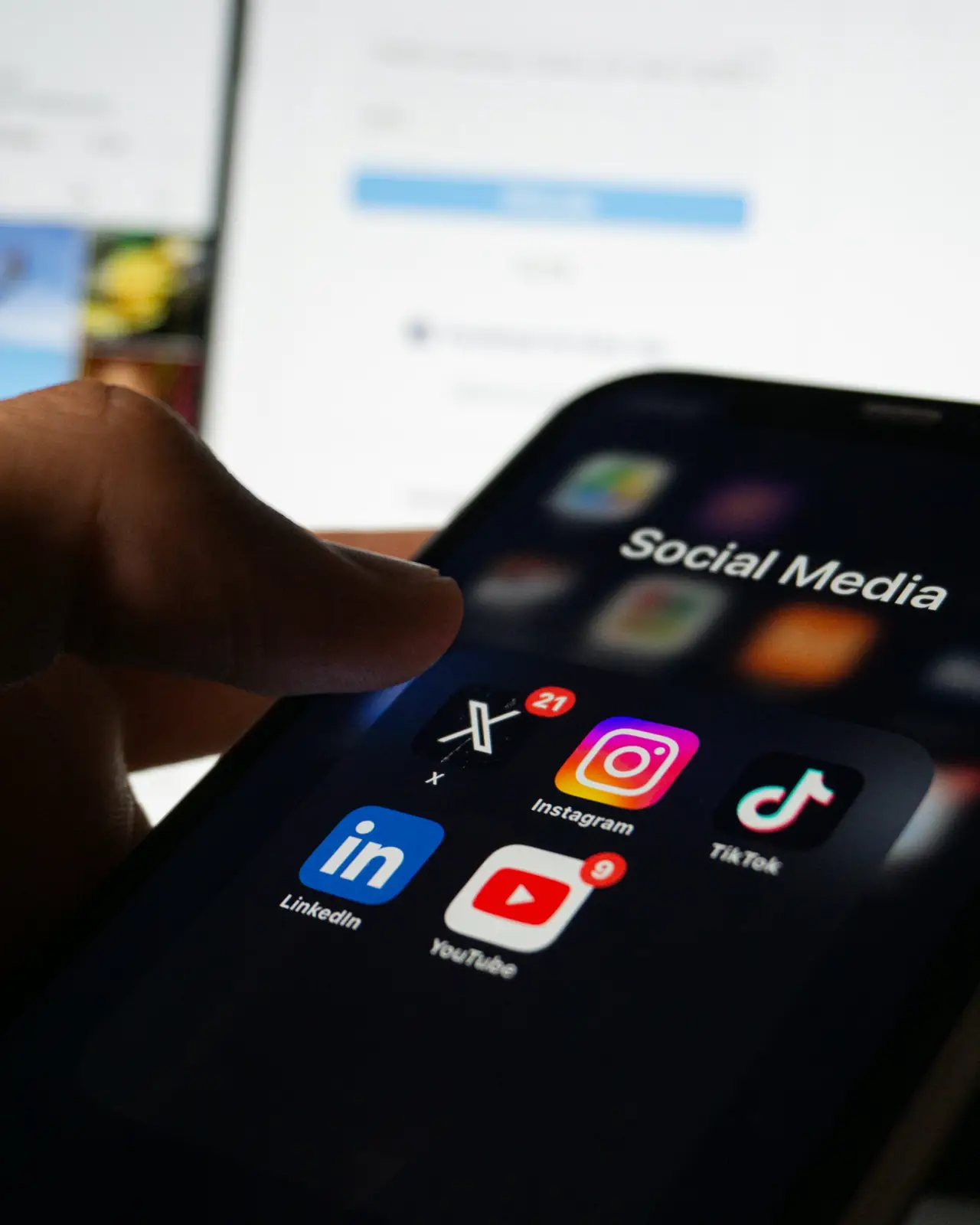 Smartphone displaying a folder of social media apps