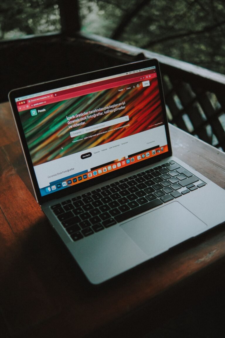 Laptop with a website open near a window
